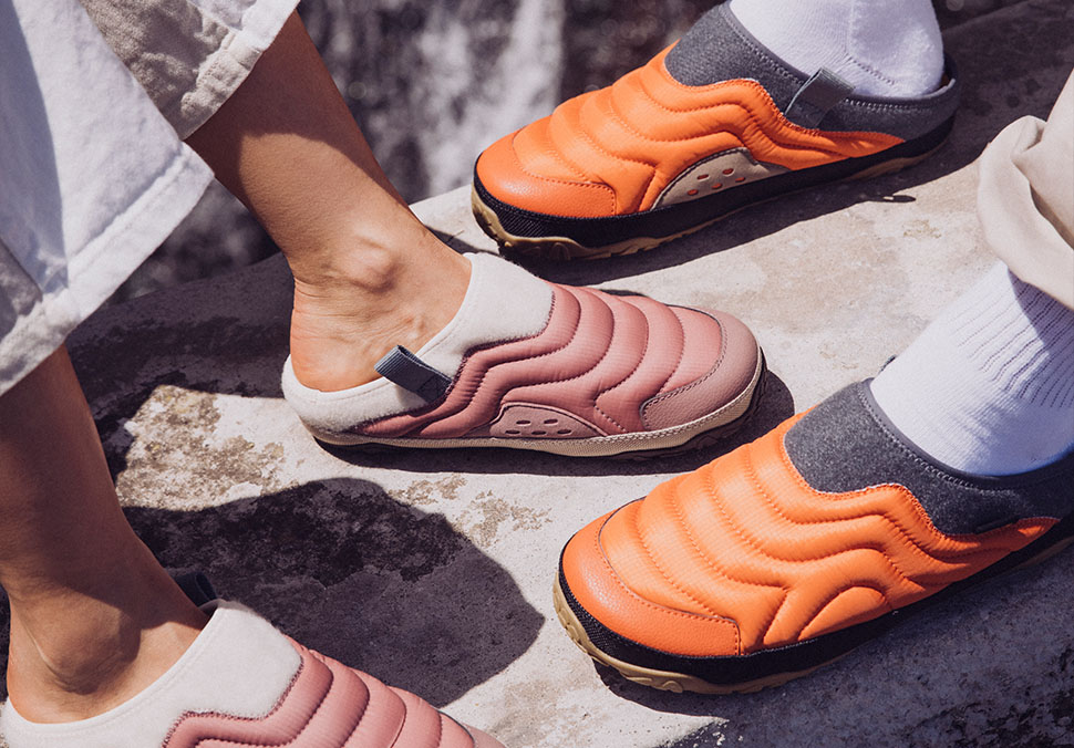 Closeup of two people's feet, wearing ReEmber terrain.