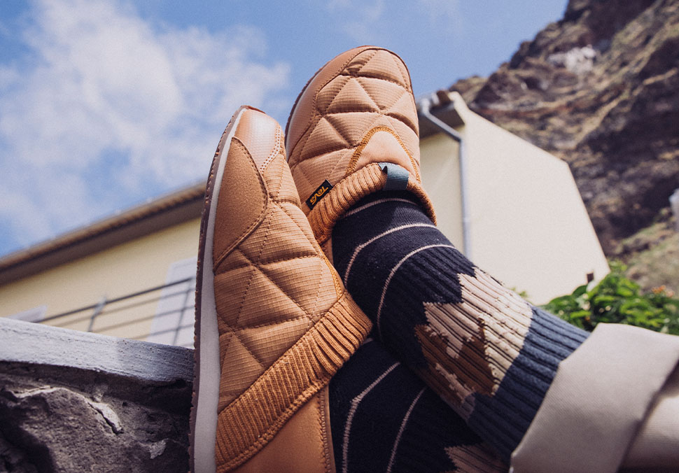 Close up of someone's feet wearing Teva 'ReEmber' shoes.