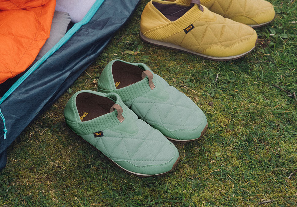 A close up of Teva 'ReEmber' shoes next to a tent.