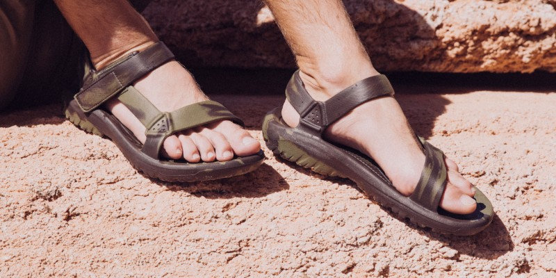 Close up of a person's feet wearing Teva Sandals.