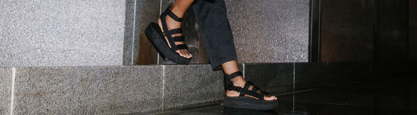 Flatform Sandals Close up of a woman's feet wearing Teva Flatform Sandals.