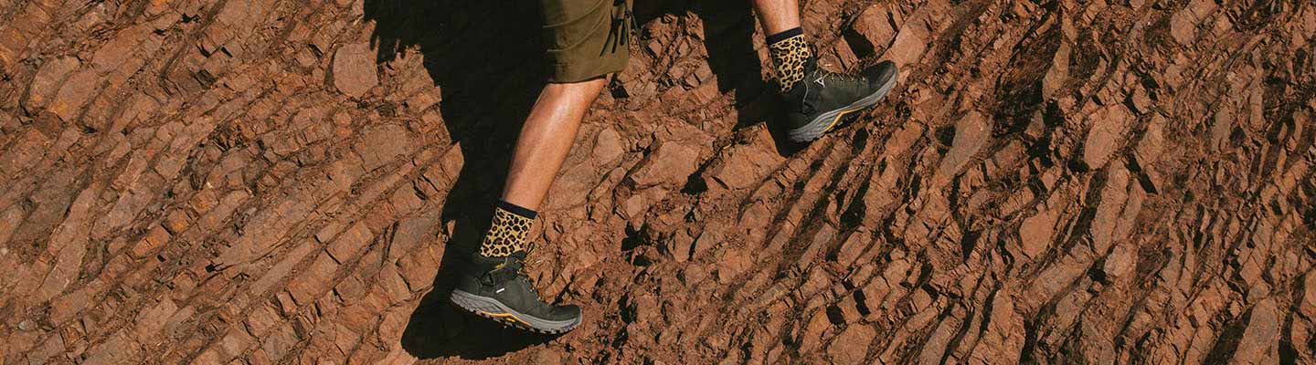 Mens Boots A man mountain climbing wearing Teva Boots.