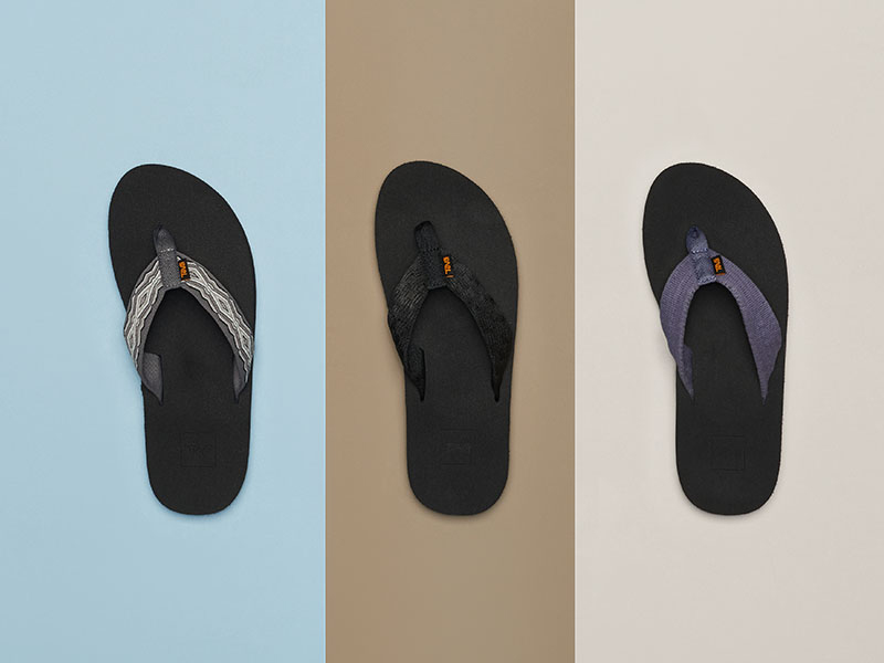 Teva flip flops against a colorful background.