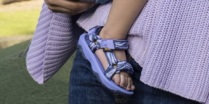 Close up of kid's foot wearing a Teva Sandal.