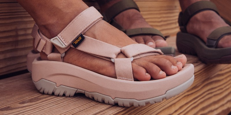 Close up of a person's feet wearing Teva Sandals.