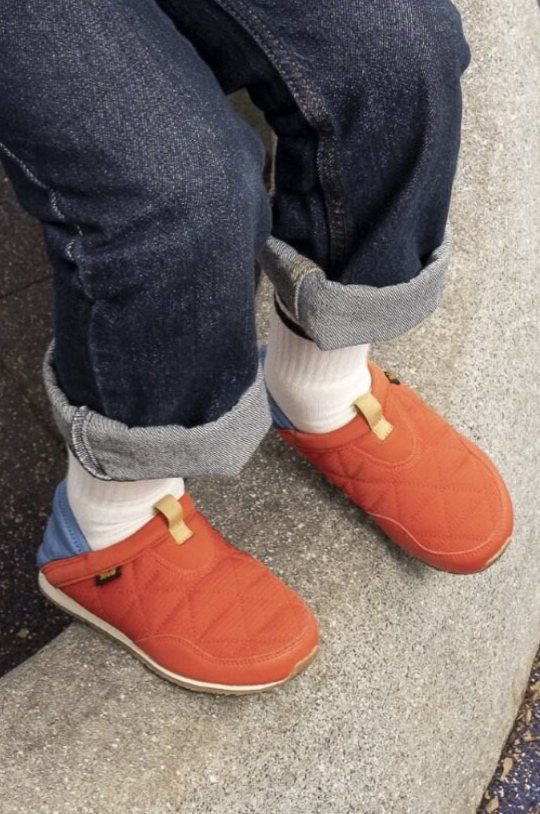 Close up of a kid's feet, wearing Teva Sandals.